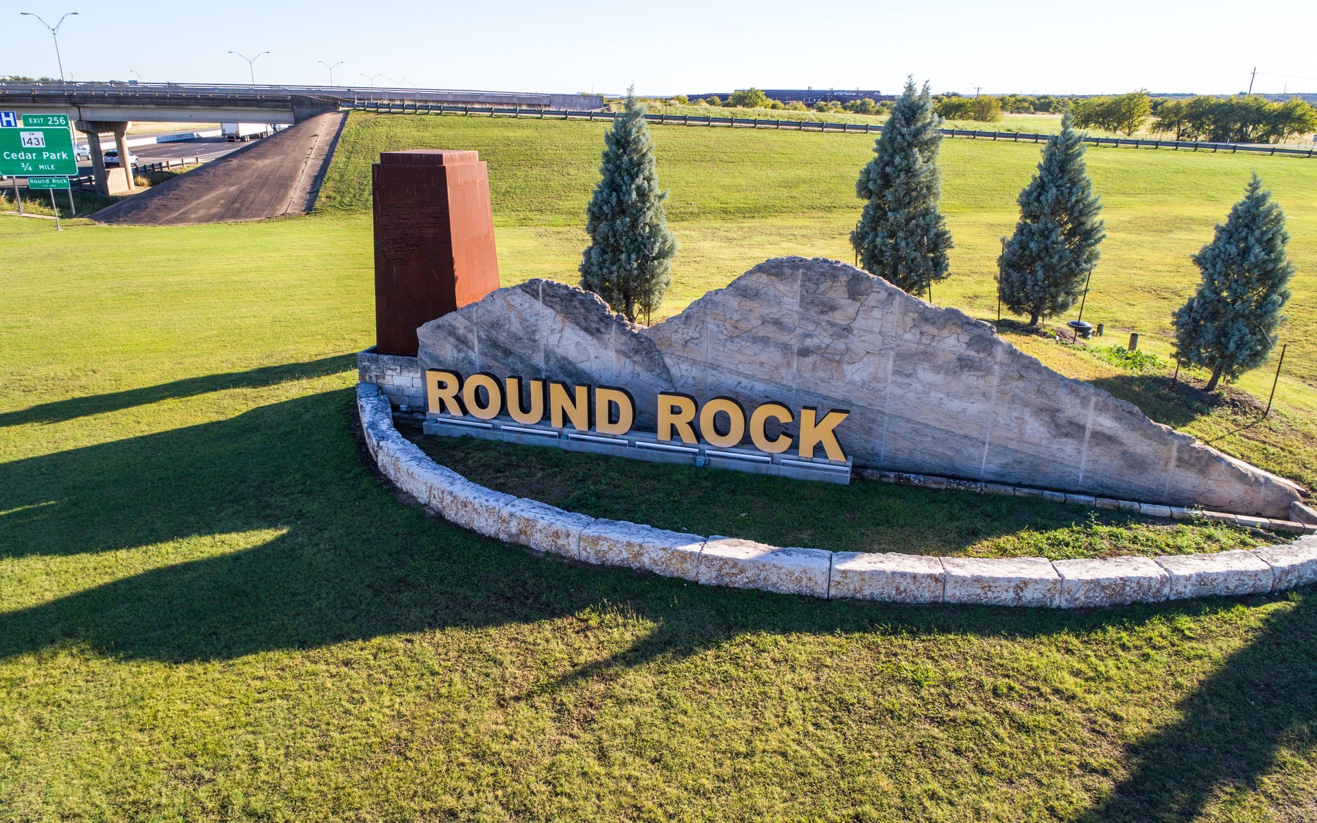 Welcome sign at Round rock  , Texas small town highway intersection overpass travel road way